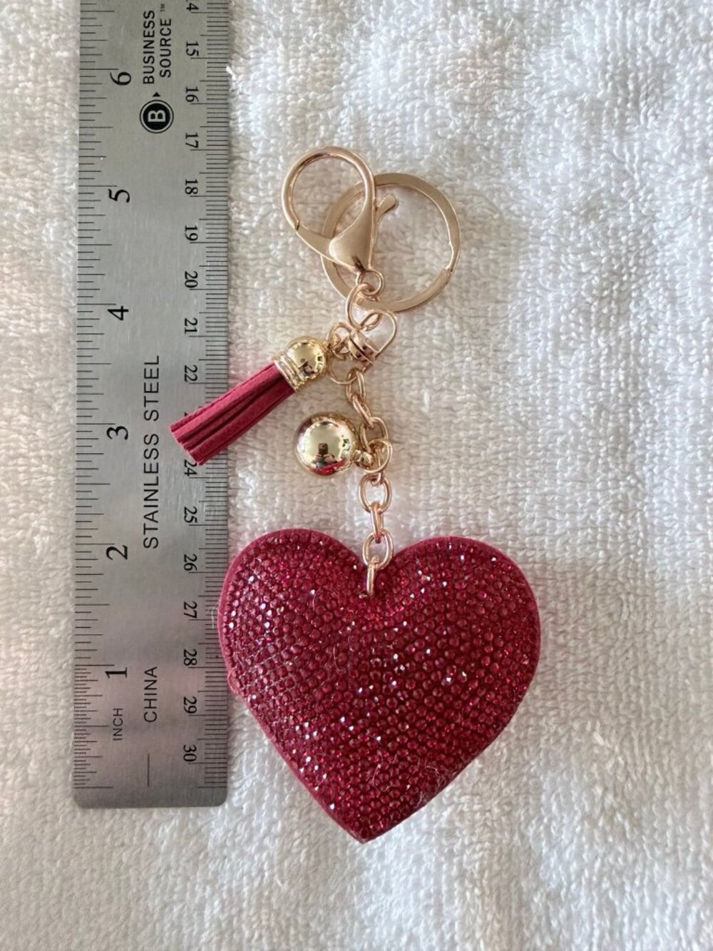 Soleebee glitter heart keychains in red, featuring a tassel and crystal-encruste